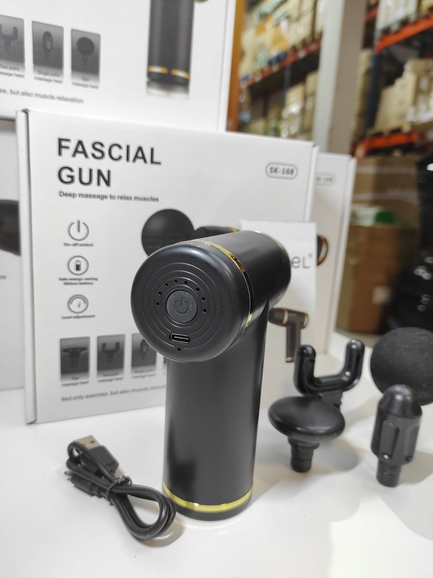Pistola de masaje